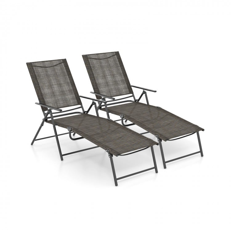 Two coffee-colored folding chaise lounge chairs with adjustable backrests, perfect for backyard or poolside relaxation.