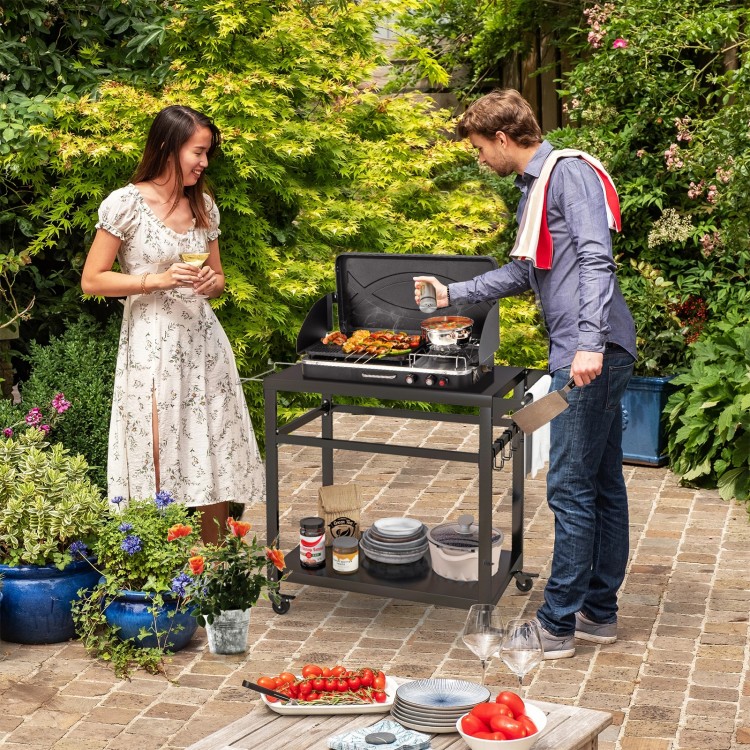 Double-shelf movable BBQ cart with 4 lockable wheels, perfect for outdoor cooking and food preparation in gardens.