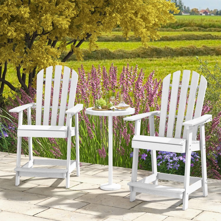 Two white HDPE patio chairs with armrests and footrests beside a small table, perfect for outdoor relaxation.