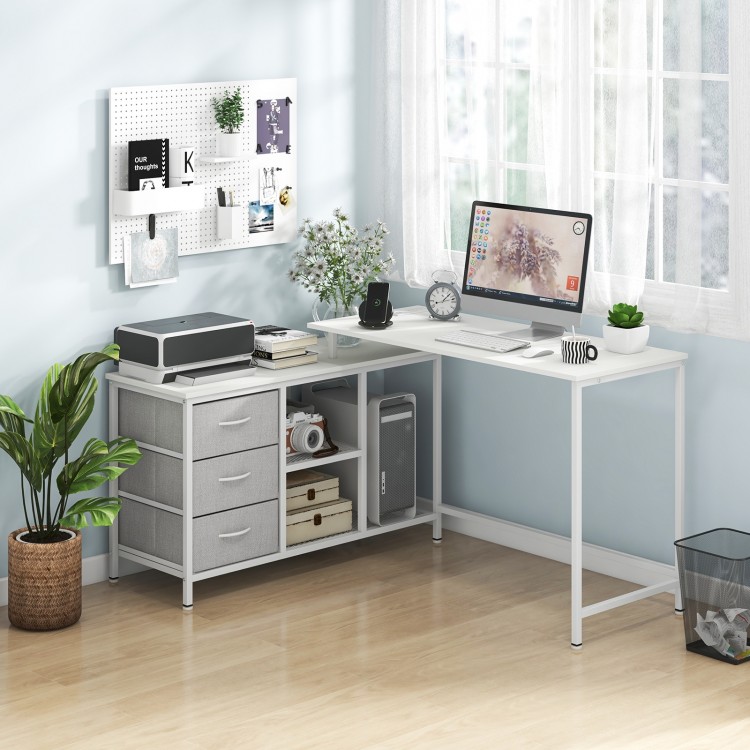 L-shaped computer desk in white with power outlet, featuring spacious surface and fabric drawers for organized.