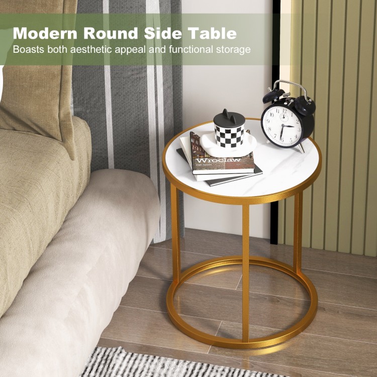 Round side table with faux marble top and golden metal frame, perfect for small spaces in bedrooms or living rooms.