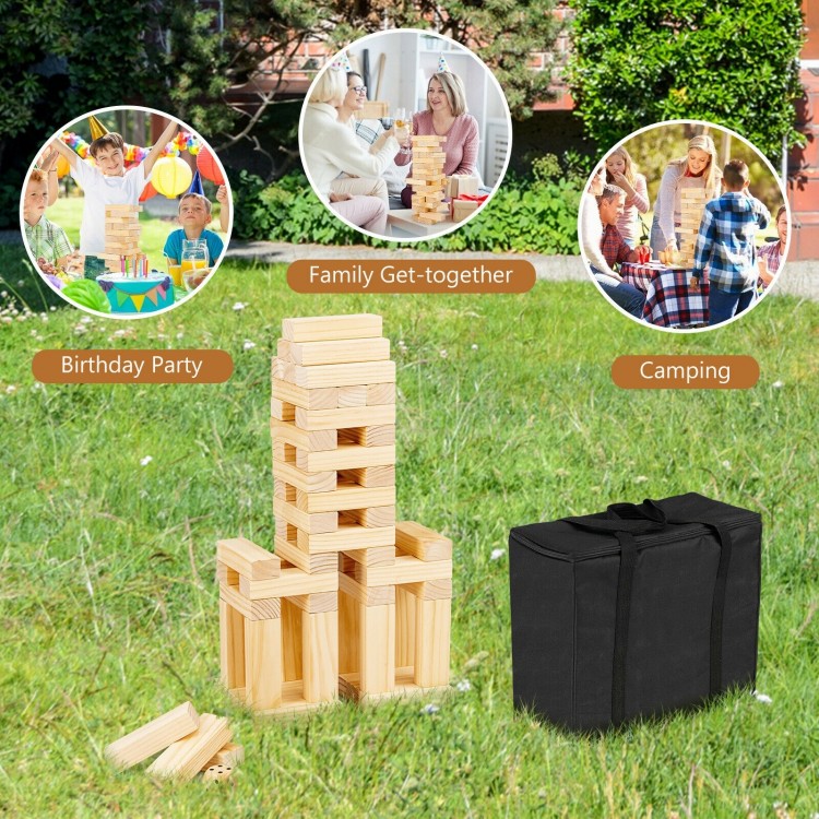 54 pieces of natural pine wood tumbling timber toy stacked in a garden, ideal for family gatherings and outdoor fun.