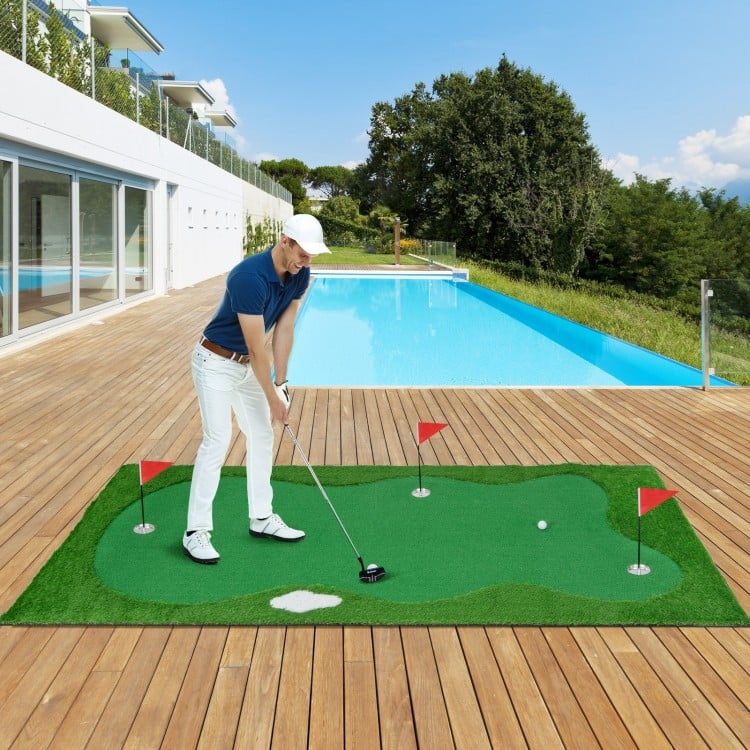 Golf putting green with realistic artificial grass turf, showcasing a golfer practicing on the course beside a swimming.