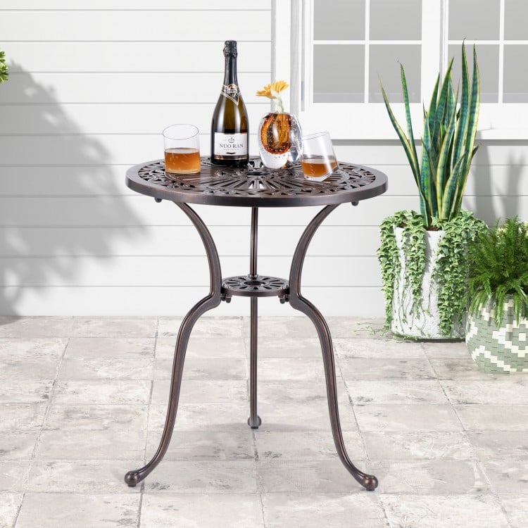 24-inch round cast aluminum bistro table with elegant patterns, featuring a 2-inch umbrella hole for outdoor dining.