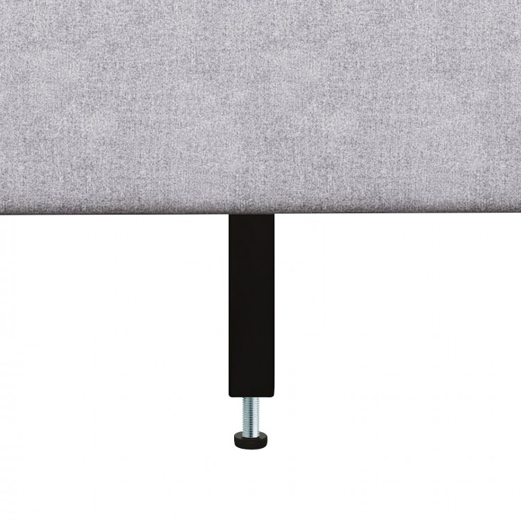 Close-up of the adjustable leg of a queen size upholstered platform bed with a button tufted headboard for stability.