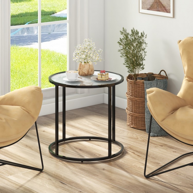 Round 20-inch glass end table with faux marble top and black metal frame, perfect for living room or balcony use.
