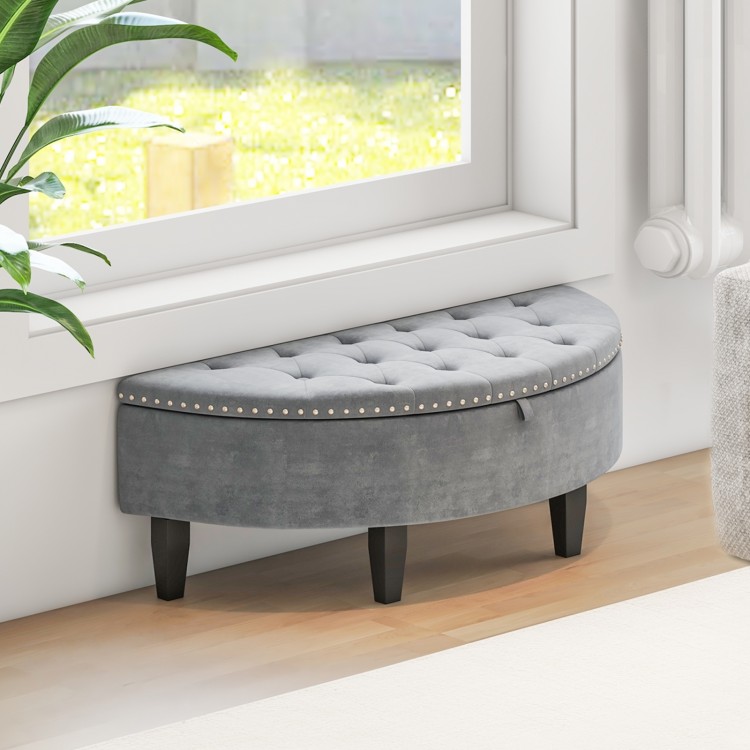 Half-moon storage bench in gray velvet with nailhead trim and rubber wood legs, perfect for stylish storage in any room.