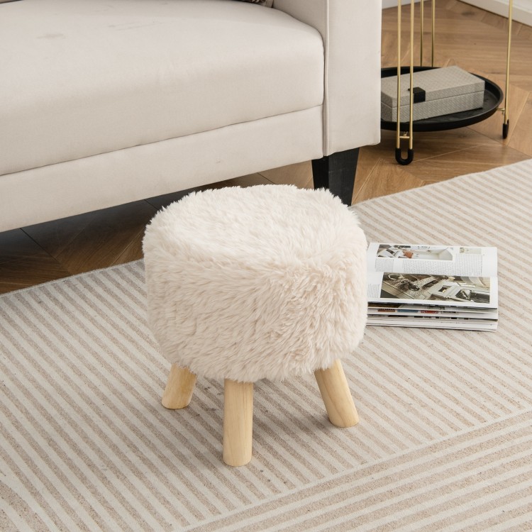 Round footstool ottoman with white faux fur upholstery and rubber wood legs, perfect for living room or bedroom use.