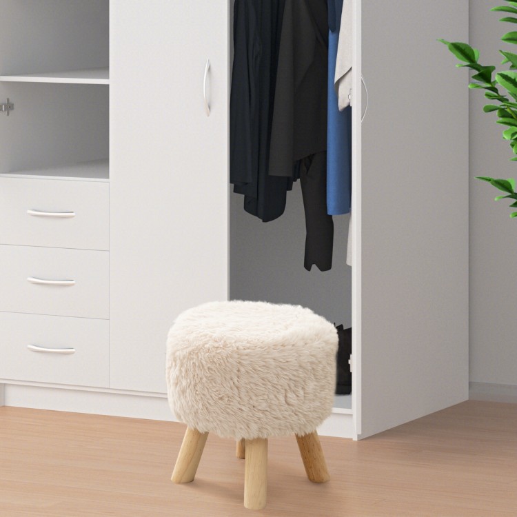 Round faux fur footstool with padded seat and rubber wood legs, perfect for living room or bedroom use.