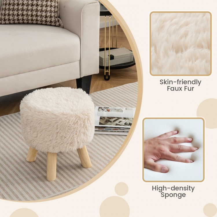 Round faux fur footstool with rubber wood legs, featuring a padded seat for comfort, perfect for living room use.
