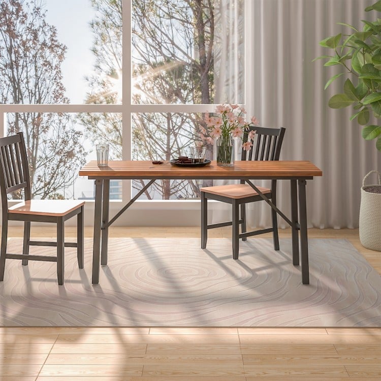 Folding picnic table featuring a smooth acacia wood surface and sturdy metal frame, ideal for family gatherings indoors.