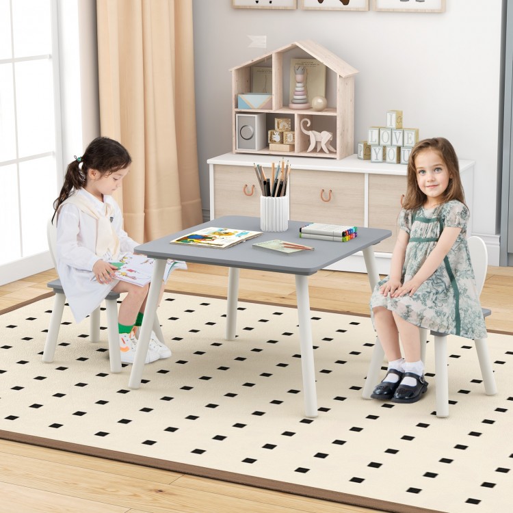 Children sitting at a gray kids table with bunny ear backrests, ideal for drawing and snack time in a cozy playroom.
