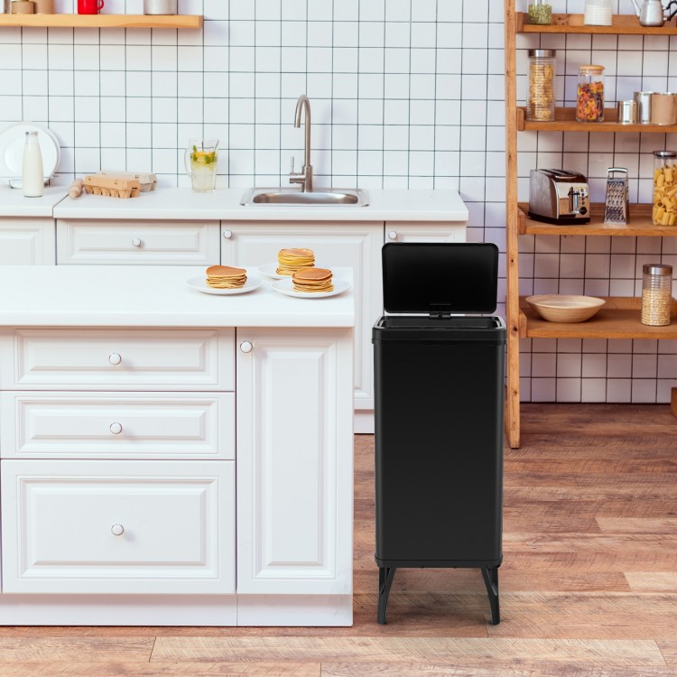 Black 13.2-gallon stainless steel trash can with stay-on lid and soft closure, ideal for a hygienic kitchen setup.
