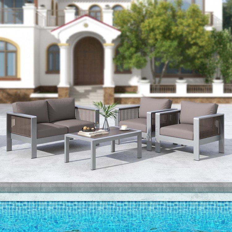 Patio aluminum loveseat sofa set with thick gray cushions, perfect for outdoor relaxation by the pool.