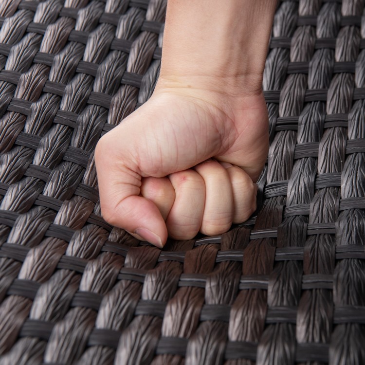 Close-up of the durable brown rattan surface of the 4 Piece Patio Gliding Set, showcasing its premium texture and.