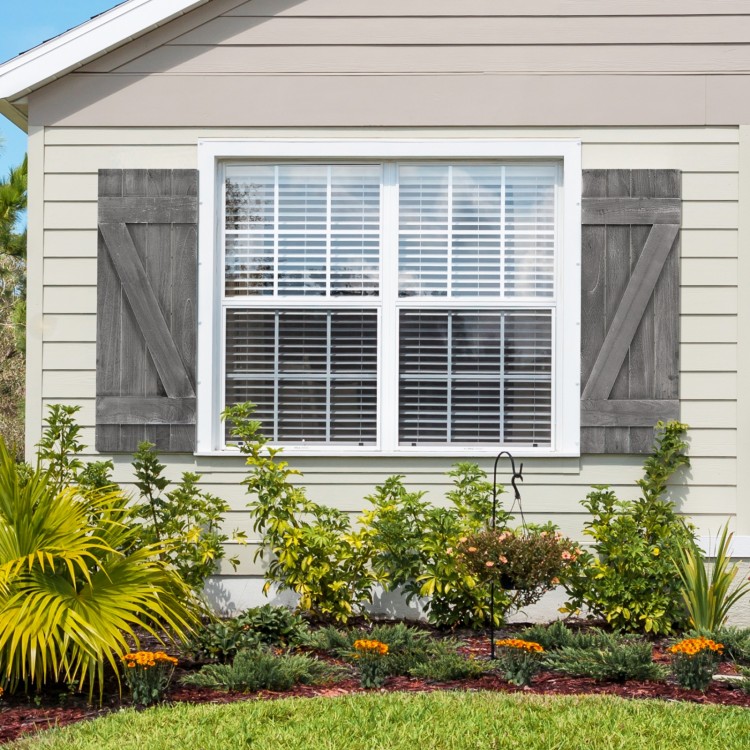 Dark gray farmhouse window shutters made of durable paulownia wood, enhancing window decor for living spaces.