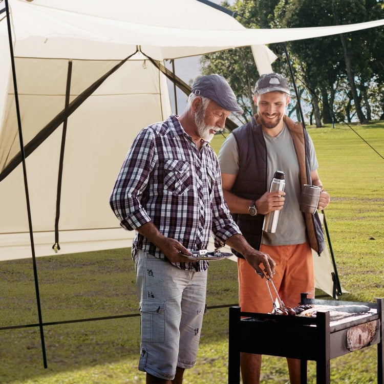 Two men grilling under a beige 10 x 10 feet screened canopy tent, ideal for camping and outdoor activities.
