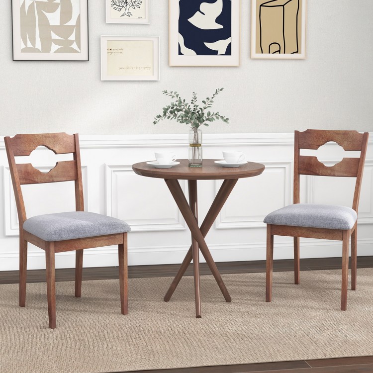 Set of 2 gray fabric upholstered dining chairs with padded seats and natural rubber wood frames for rustic kitchen.
