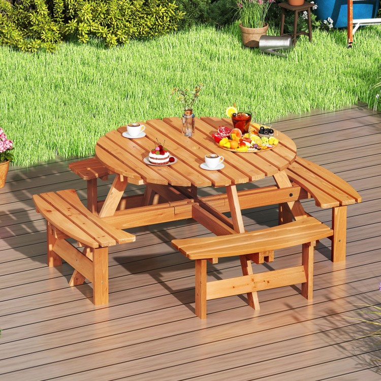 Round picnic table set made of natural fir wood with 4 benches, perfect for outdoor dining with family and friends.
