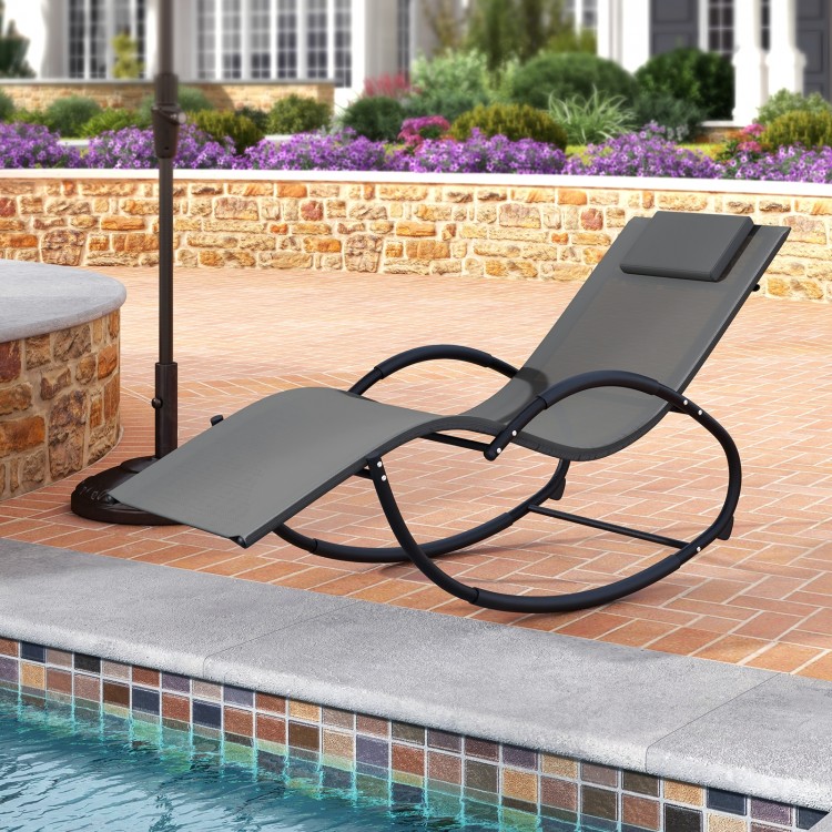 Gray outdoor rocking lounge chair with removable headrest, featuring a curved base and ergonomic design for poolside.