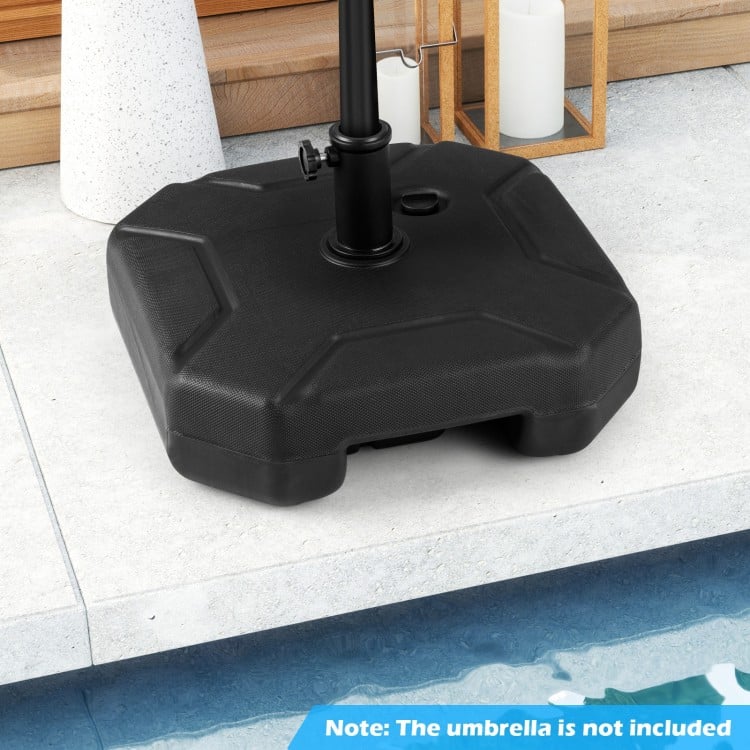 Heavy-duty 17-inch umbrella base made of HDPE, fillable with water or sand, featuring a carrying handle for easy.