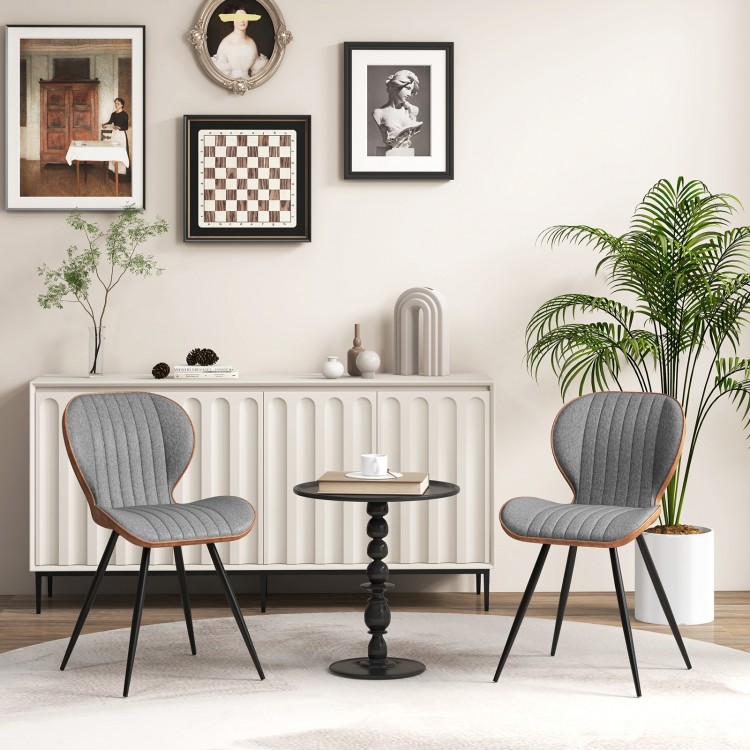 Set of 2 gray armless dining chairs with curved backrest and X-shaped metal frame, perfect for modern accent decor.