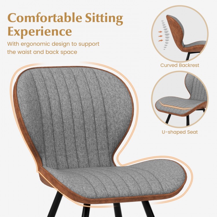 Curved backrest and U-shaped seat of a gray armless dining chair, designed for comfort and elegance in any space.