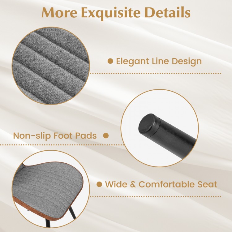 Curved backrest and wide seat of gray armless dining chair, featuring elegant line design and non-slip foot pads.