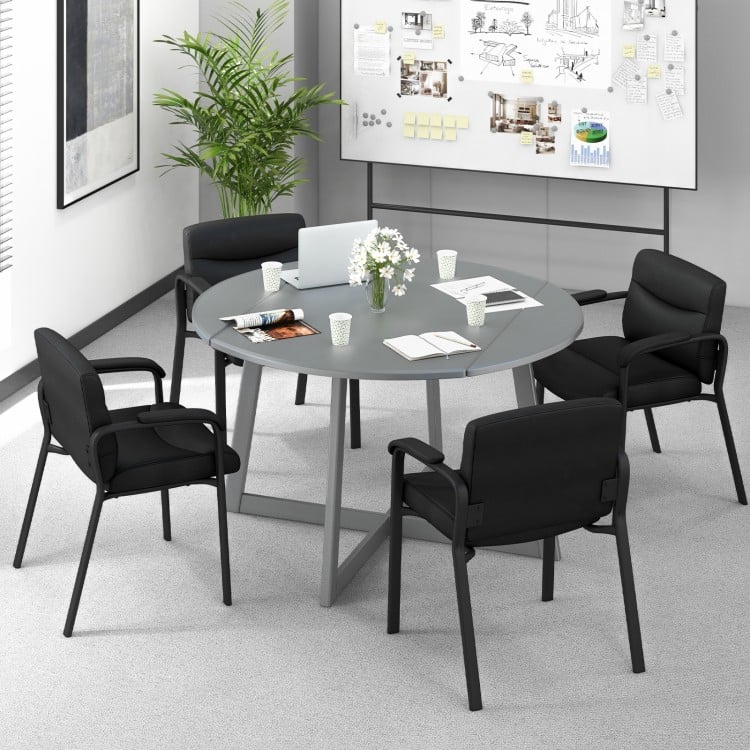 Black waiting room chairs with ergonomic backrests and soft padded armrests, perfect for office or conference use.