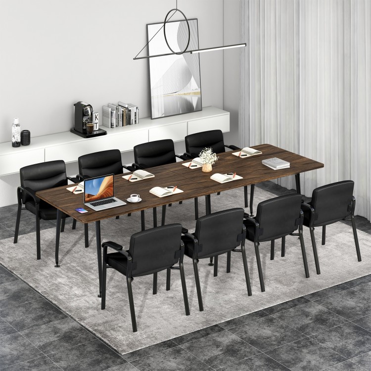 Black waiting room chairs with ergonomic backrest and padded armrests, ideal for office or conference room settings.