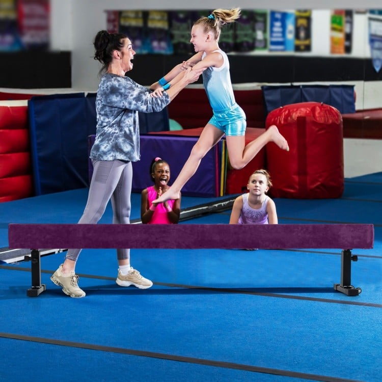 Adjustable 7.5 ft gymnastics beam in purple, featuring a non-skid surface, ideal for safe practice at various heights.