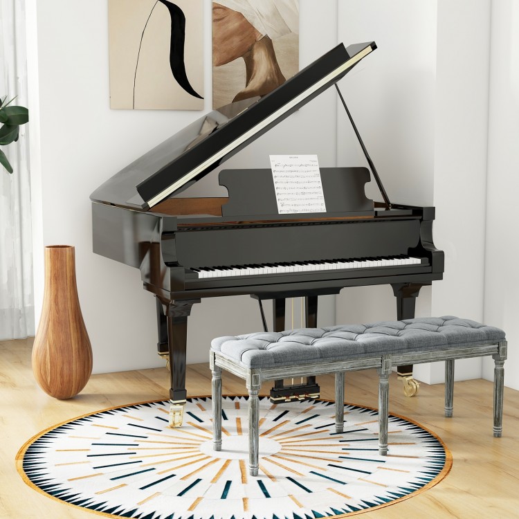 Upholstered gray entryway bench with artistic button tufting, suitable for living room or dining use, 47 inches long.
