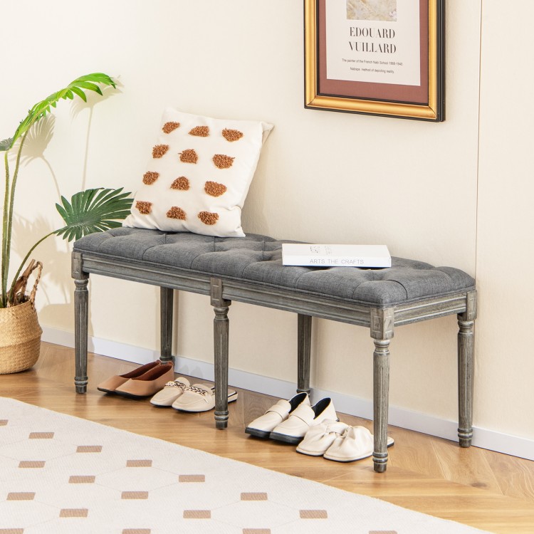 Gray upholstered French vintage entryway bench with natural rubber wood legs, suitable for living room or bedroom use.