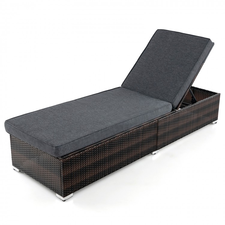 Patio wicker lounge chair with adjustable 4-position backrest and luxurious cushion for outdoor relaxation.