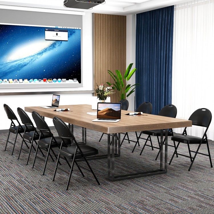 Padded folding chairs with a metal frame in black, ideal for meetings and events, featuring a convenient carry handle.