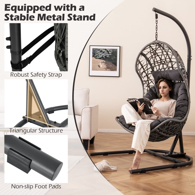 Gray egg chair with a stable metal stand, featuring a cushion and pillow for comfort, ideal for living room or patio.