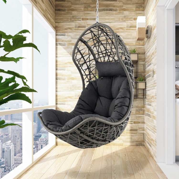 Hanging egg chair in gray PE rattan with soft pillow, perfect for relaxing on a balcony or patio.