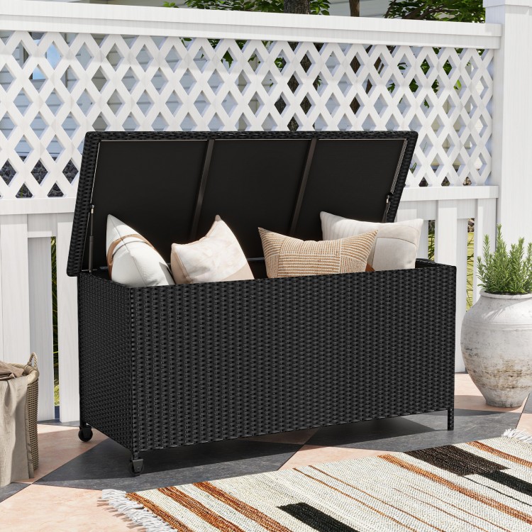 Black 85-gallon storage container with waterproof liner, ideal for cushions and outdoor use, featuring universal wheels.