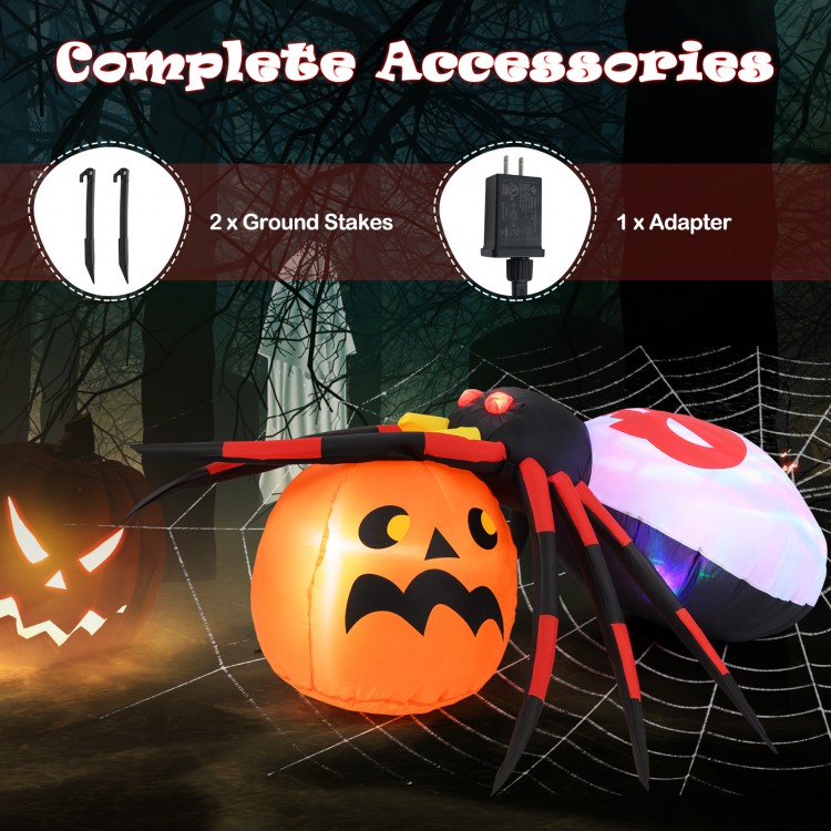 Inflatable spider on a pumpkin with colorful rotating lights, perfect for backyard Halloween decoration.
