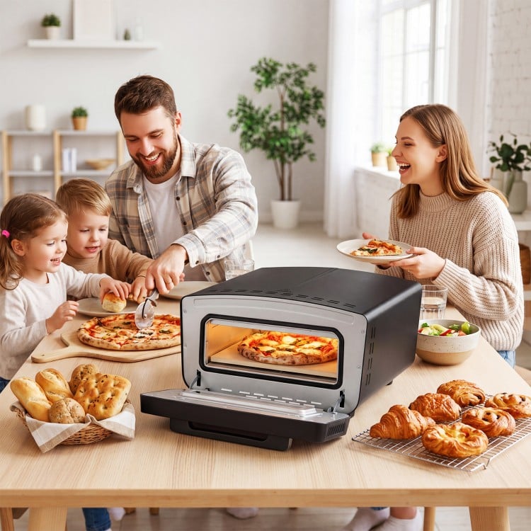 Indoor electric pizza oven in black with dual heating zones, ideal for 12-inch pizzas and family gatherings.