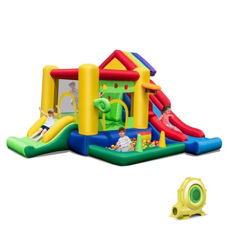Colorful inflatable bounce castle with double slides, climbing wall, and ocean ball pool for indoor or outdoor fun.