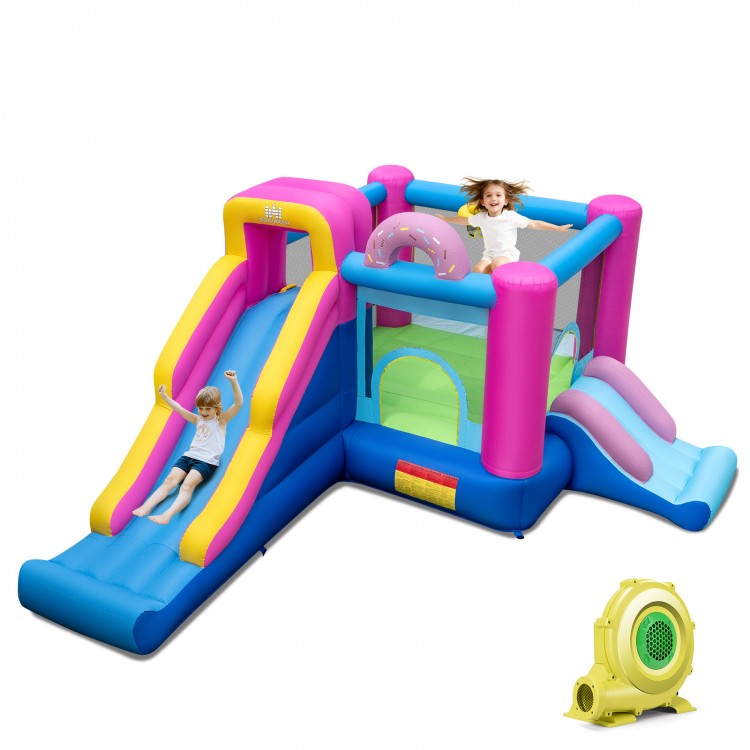 Inflatable bounce house with slides and basketball hoop, featuring a colorful doughnut theme for backyard fun.