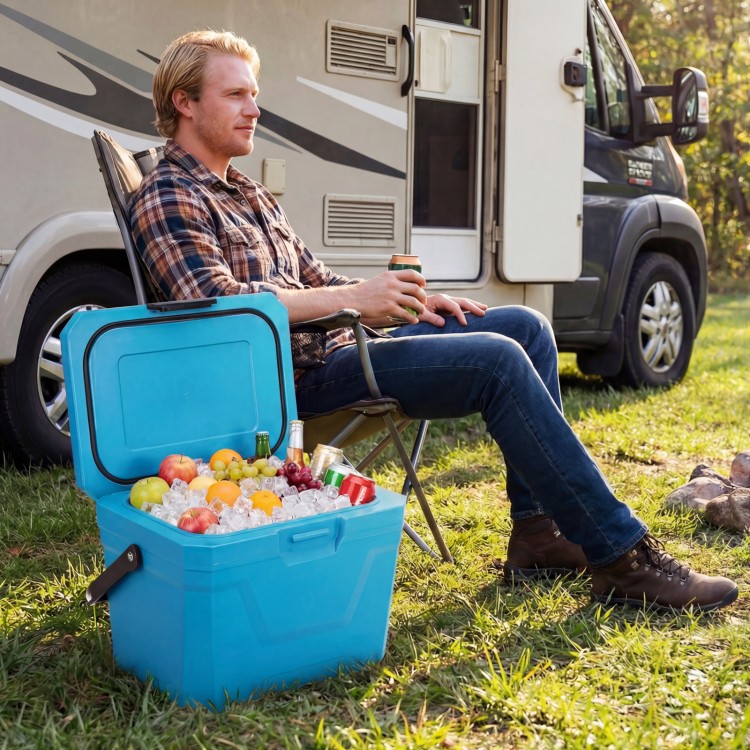 Insulated portable cooler in blue with ice, fruits, and drinks, perfect for camping and outdoor activities.