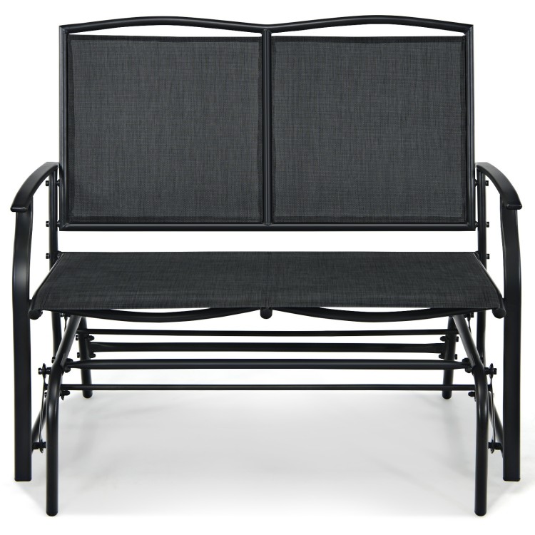 Black iron patio rocking chair with comfortable seating for two, perfect for outdoor relaxation in the backyard.
