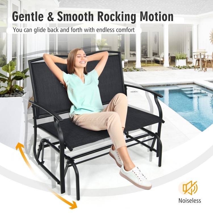 Black iron patio rocking chair for two, featuring a smooth gliding motion, perfect for outdoor relaxation.