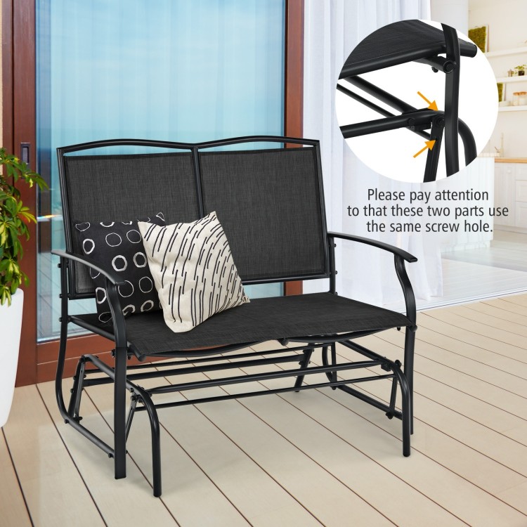 Black iron patio rocking chair for two, featuring a durable metal frame, ideal for outdoor relaxation.