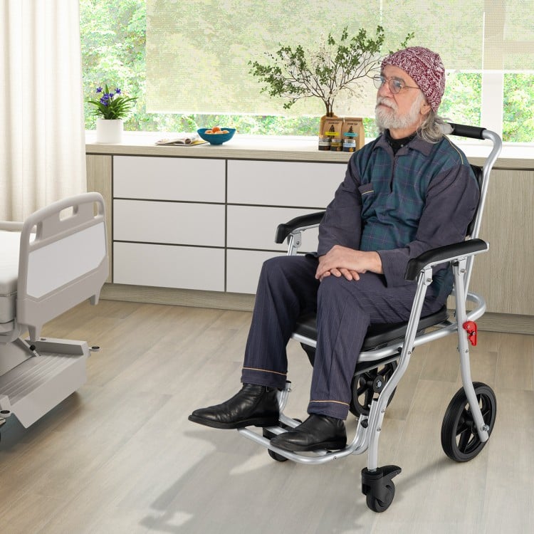 4-in-1 Foldable Bedside Commode Chair with Brakes and Bucket and Footrest - Gallery View 1 of 10