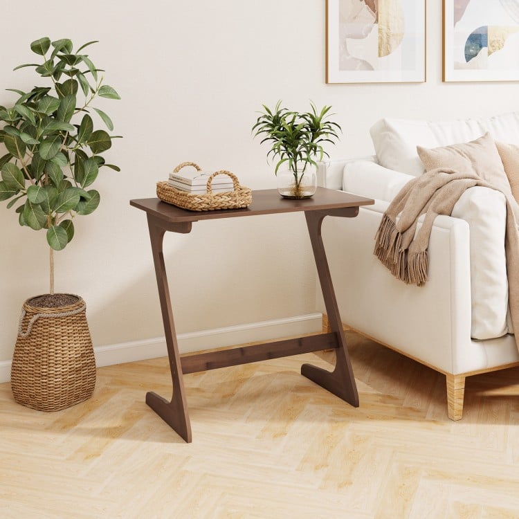 Z-shaped brown bamboo side table with spacious tabletop, ideal for small spaces and multi-functional use in living.