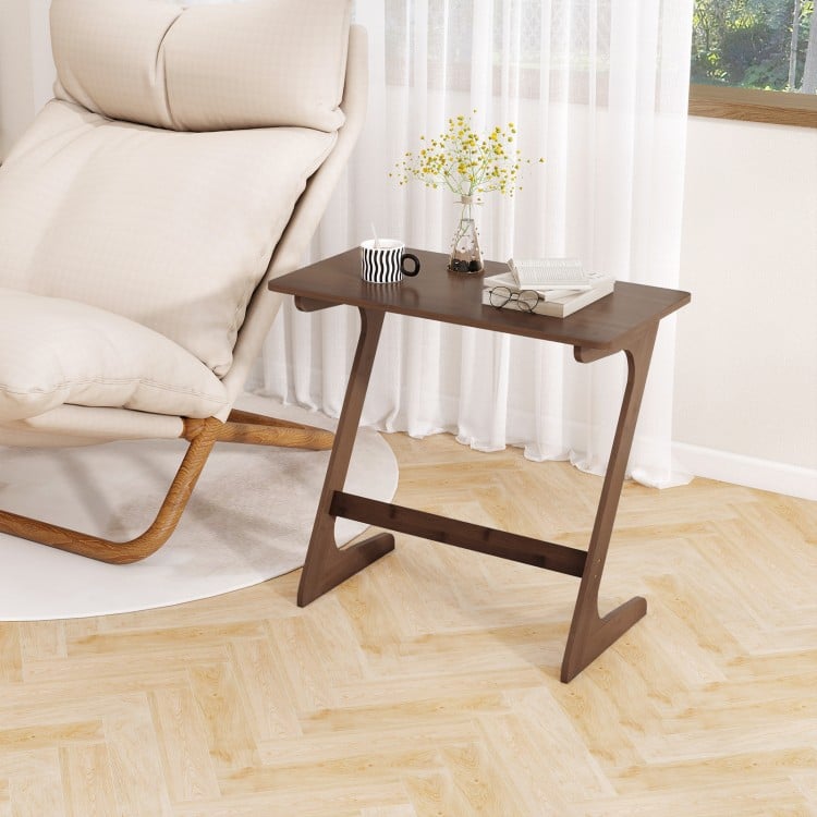 Z-shaped brown bamboo side table with spacious tabletop, ideal for snacks and laptops, perfect for small spaces.