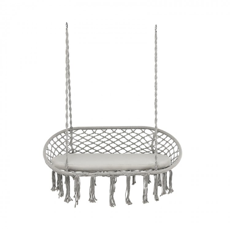 Gray 2-person macrame hammock chair with cushion, featuring bohemian style and sturdy design for indoor or outdoor use.